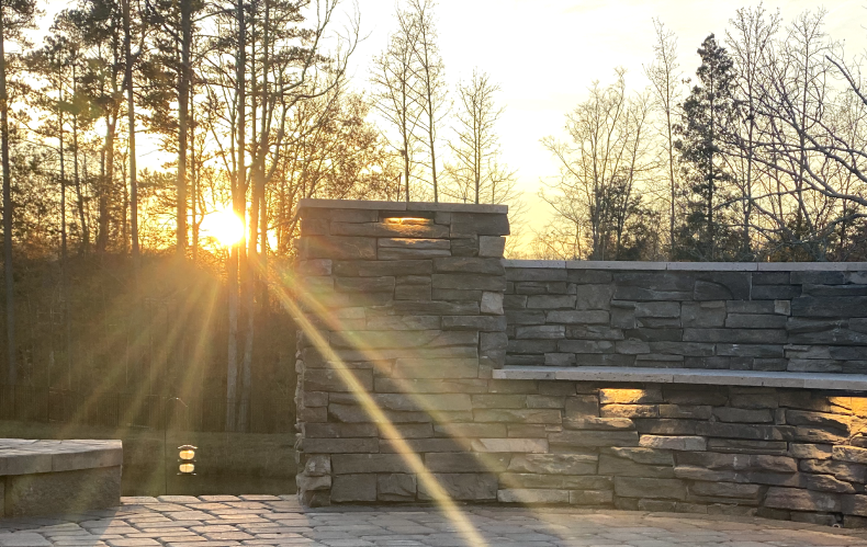 Exterior stone walls with outdoor lighting embed in it