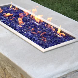 A rectangular fire pit ignited and decorated with beautiful glass stones.