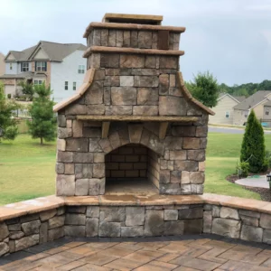 A stone fireplace in a patio