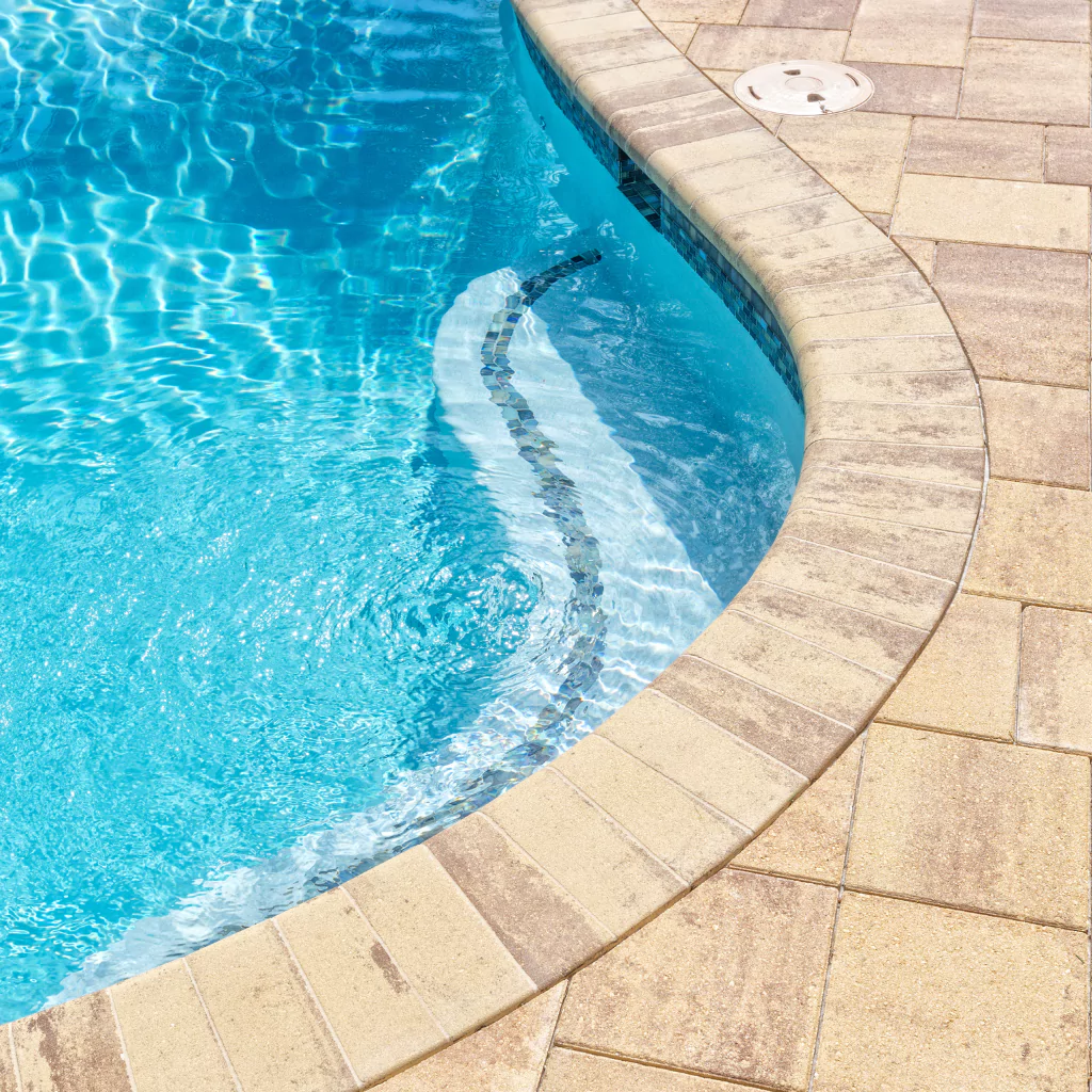 Natural stone pavers and a pool