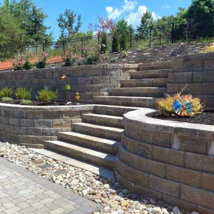 A retaining wall with stone stairs.