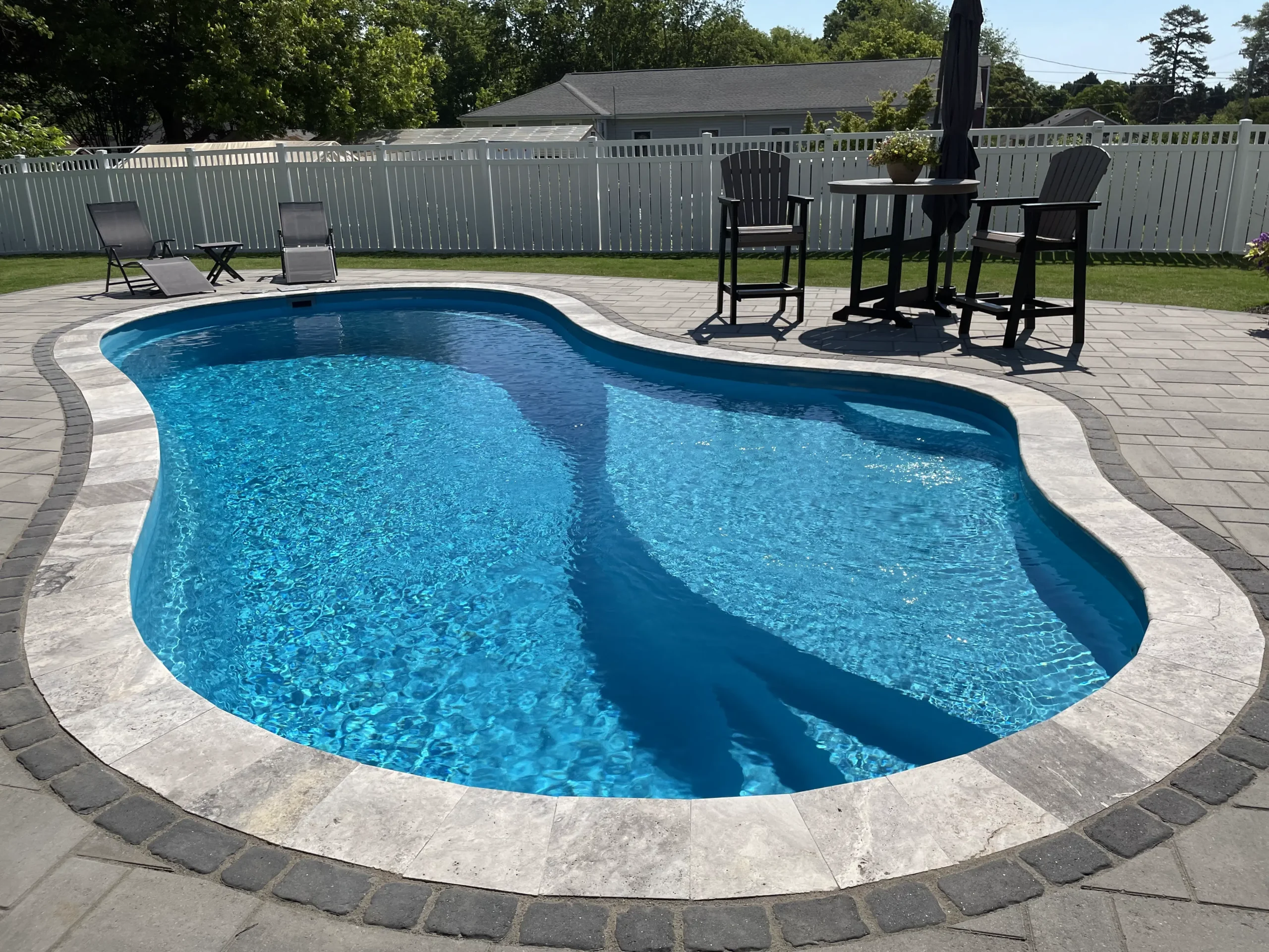 A beautiful fiberglass pool in a hot summer