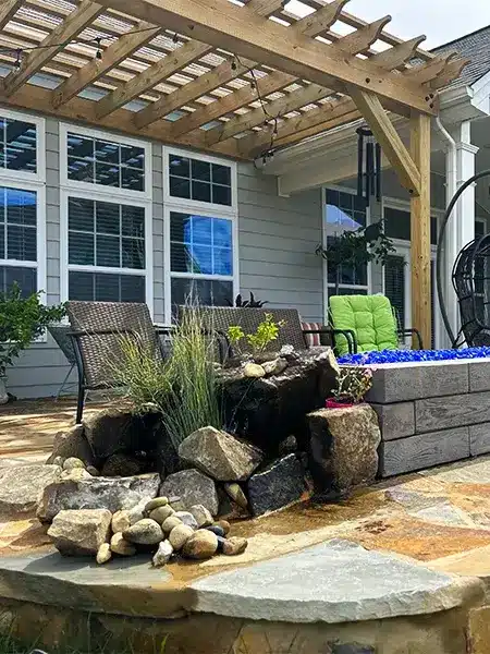 A spectacular stone fire pit built in a backyard