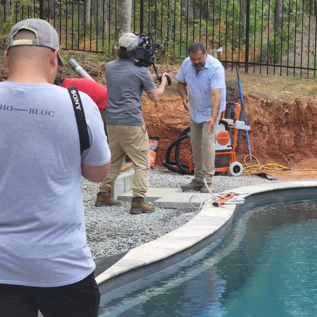 SunSouth Carolinas collaborating with Techo-Bloc and Paver Pete during a professional poolside paver and coping installation project filmed in 2023.