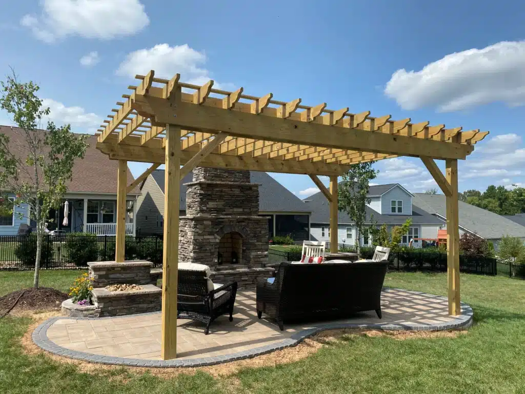 The Role of Pergolas in Comfortable Spring Patios 2 The perfect combination for outdoor enjoyment: SunSouth Carolinas installs custom wood pergolas and stunning masonry outdoor fireplaces on durable hardscaping.