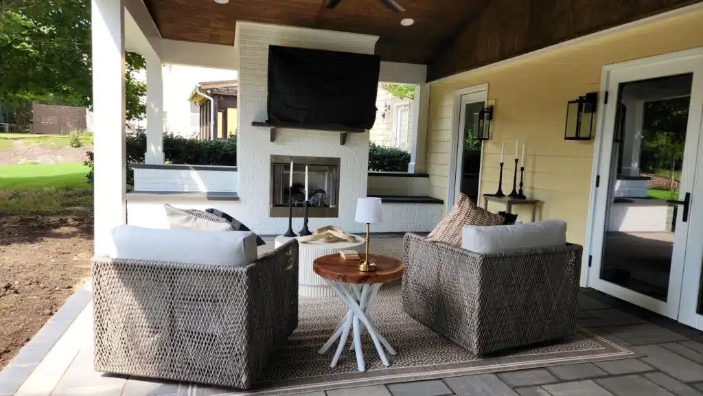 From Cold to Cozy: Small Winter Upgrades That Elevate Outdoor Comfort 1 Enjoy year-round comfort in an outdoor living space by SunSouth Carolinas, complete with a built-in masonry outdoor fireplace, integrated lighting, and stylish hardscaping.