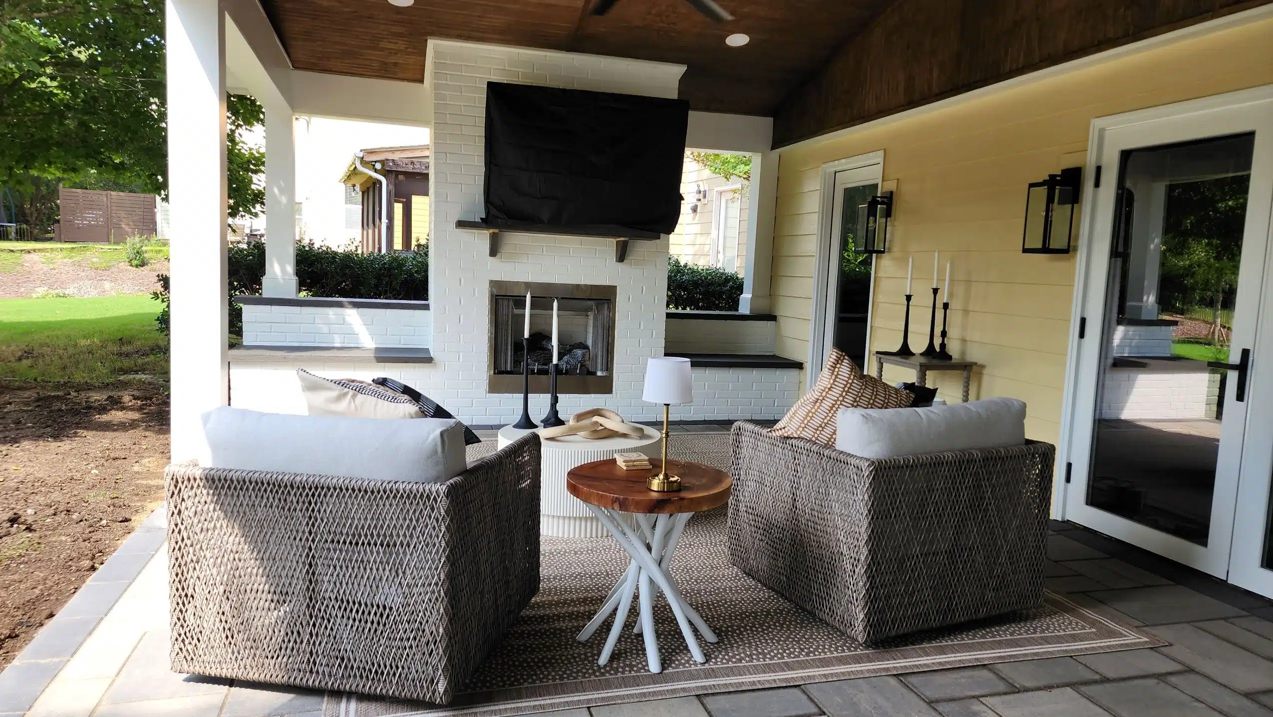 From Cold to Cozy: Small Winter Upgrades That Elevate Outdoor Comfort 1 Enjoy year-round comfort in an outdoor living space by SunSouth Carolinas, complete with a built-in masonry outdoor fireplace, integrated lighting, and stylish hardscaping.