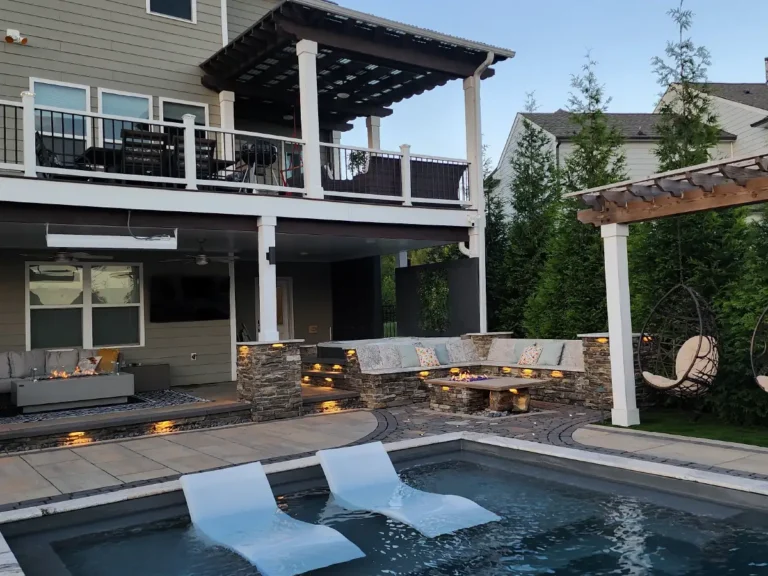 From pools and patios to pergolas and fire pits, a view of a completely integrated outdoor living project by the design-build experts at SunSouth Carolinas.