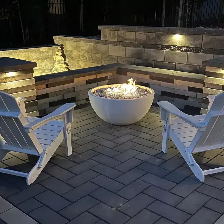 Santa’s Favorite Spot: Designing a Holiday-Ready Fireplace or Fire Pit 3 A cozy firepit at night with chairs around it.