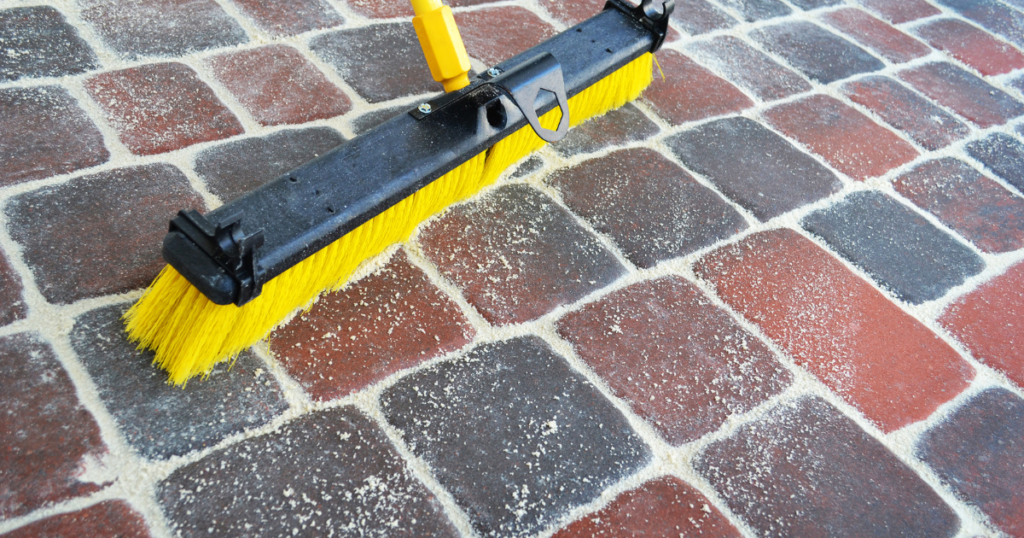 Applying polymeric sand on pavers